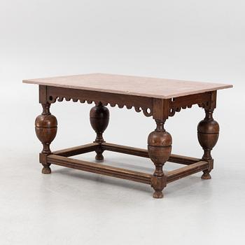 A Baroque oak and stone top table, 18th Century.