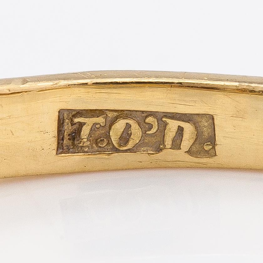 Ring, 18K guld, smaragd och diamanter ca 0.20 ct totalt. Storbritannien.