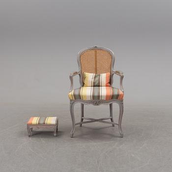 A later part of the 19th century rococo style armchair and second half of the 20th century stool.