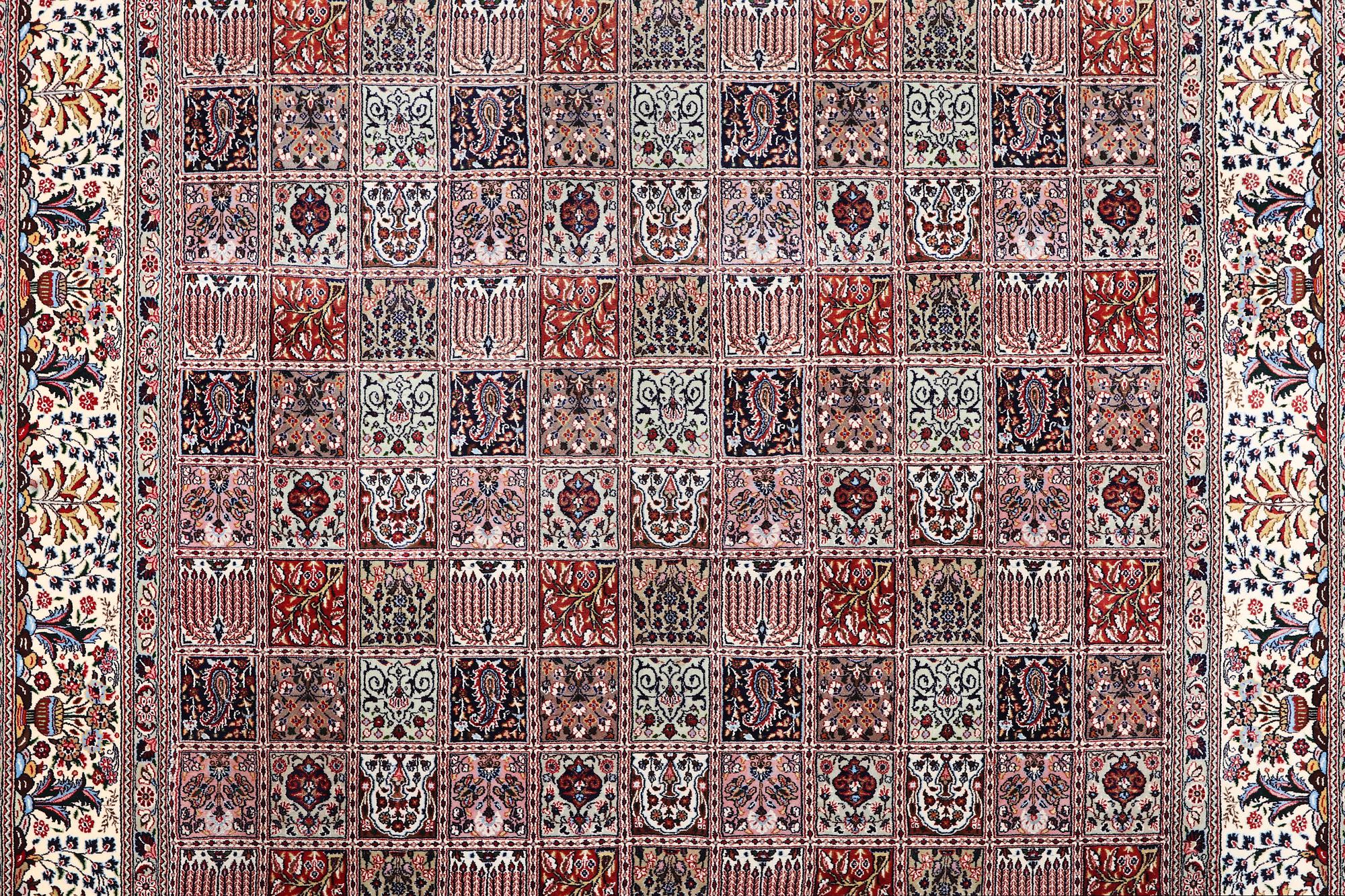 A part silk Ghom carpet, c. 346 x 251 cm.