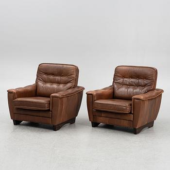 A Pair of Leather Armchairs, second half of the 20th Century.