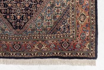 An oriental rug, approx. 203 x 135 cm.