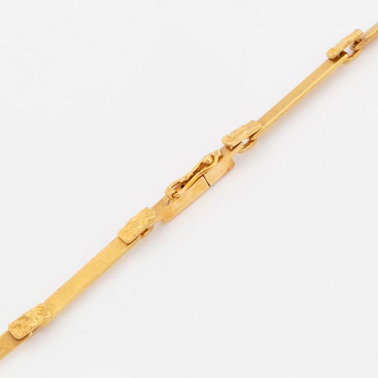 A Lapponia necklace design Björn Weckström in 18K gold set with spectrolite.