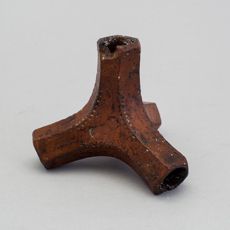 A 19th century pottery folk art candle stick.