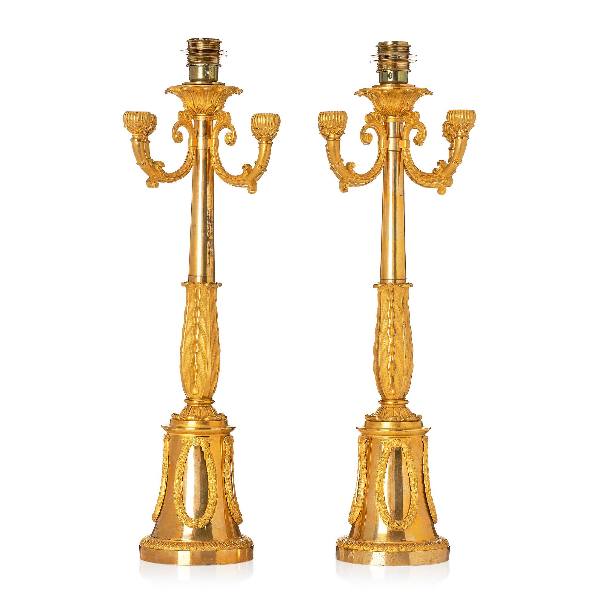 A pair of French Empire four-light candelabra (lamps), early 19th century.