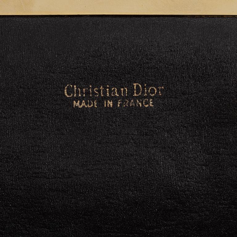 Christian Dior, a canvas clutch.