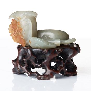 A sculptured nephrite belt buckle, figurine and brush washer, late Qing dynasty.