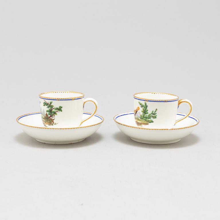 A pair of cups and saucers, "Sévrès"like mark, 19th century.