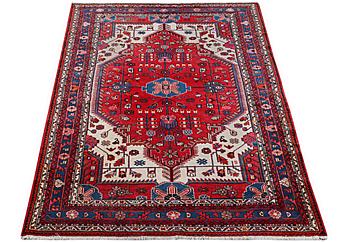 An oriental carpet, c. 230 x 151 cm.