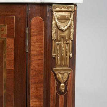 A pair of Louis XVI late 18th century corner cupboards by Léonard Boudin (1735-1804), master in Paris 1761.