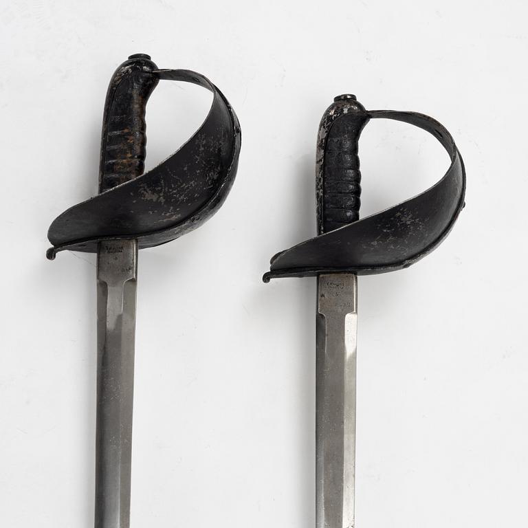 A Swedish pair of military practice swords 1886 pattern.