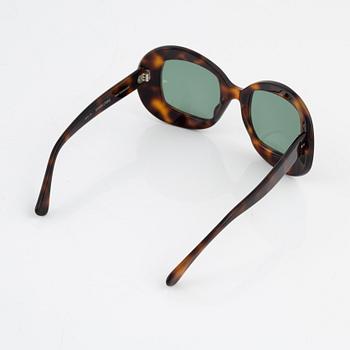 Oliver Goldsmith, a pair of "Uuksu" sunglasses.