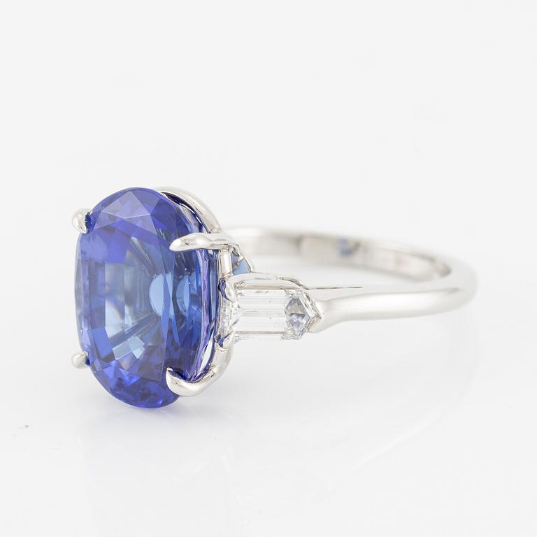 Ring, Fred Leighton platinum with an oval faceted tanzanite and fancy-cut diamonds.