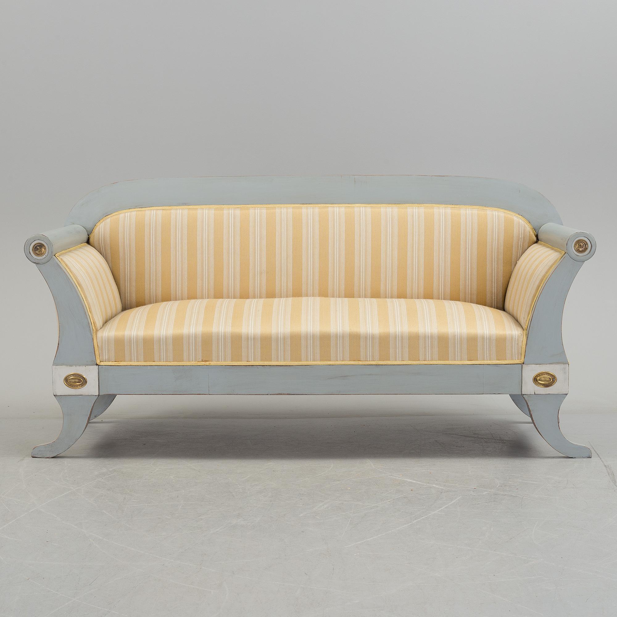 A mid 19th century painted sofa.