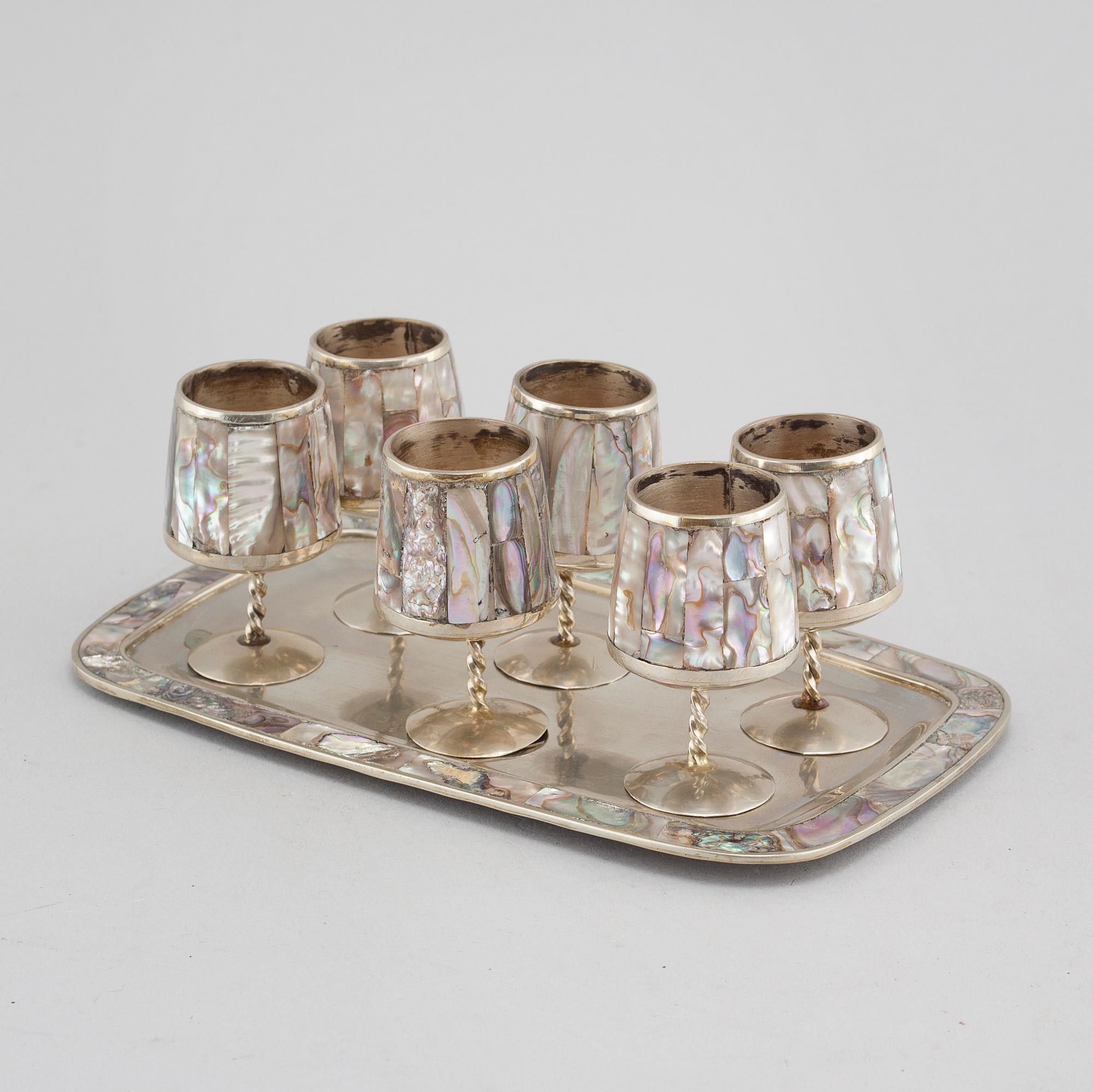 Six liqeur glasses on a tray, mother of pearl and alpaca, Mexico, second half of the 20th century.