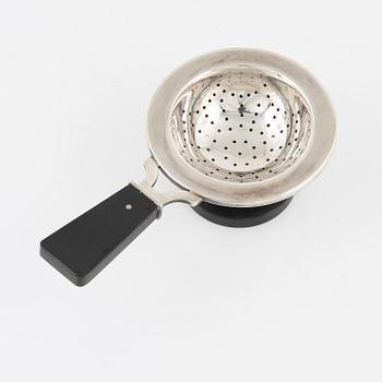 A silver tea strainer with stand, Cohr, Denmark, 1930's.