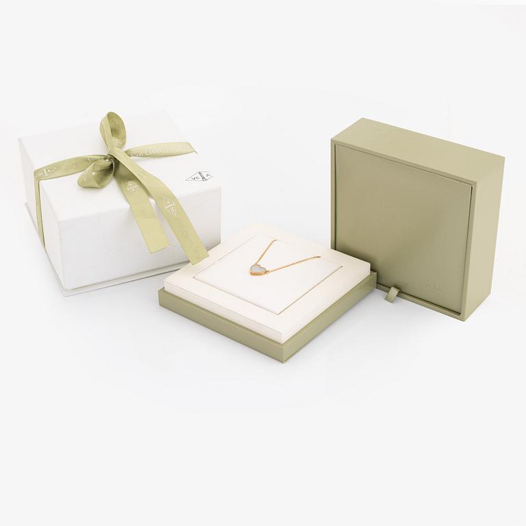 Van Cleef & Arpels, 18K gold and mother of pearl Alhambra heart necklace.