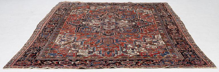 An antique Heriz carpet, west Persia, c. 333 x 238 cm.