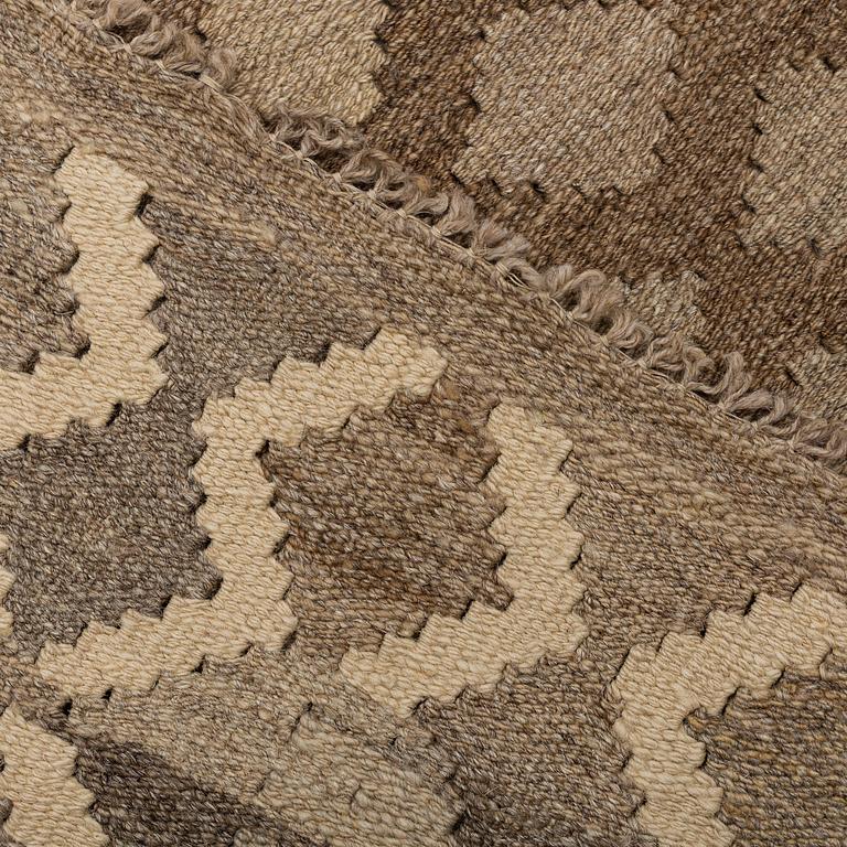 A carpet, kilim, around 254 x 160 cm.