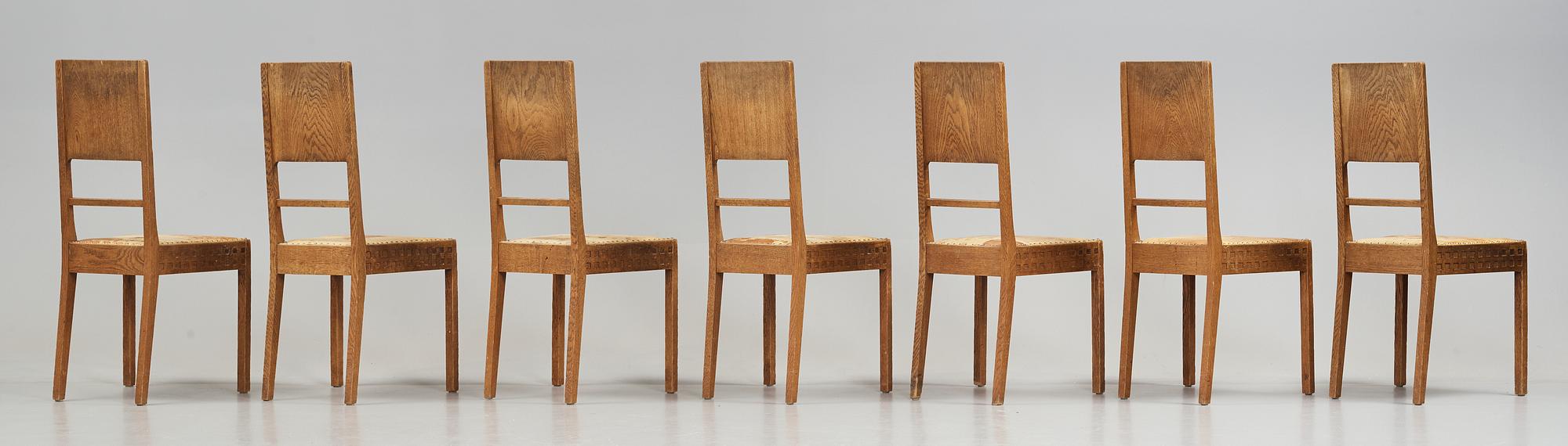 A Art Nouveau oak set with dining table, seven chairs and a side table, Finland, early 1900's.