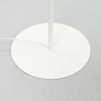 A white metal floor light, Luxus, Vittsjö.