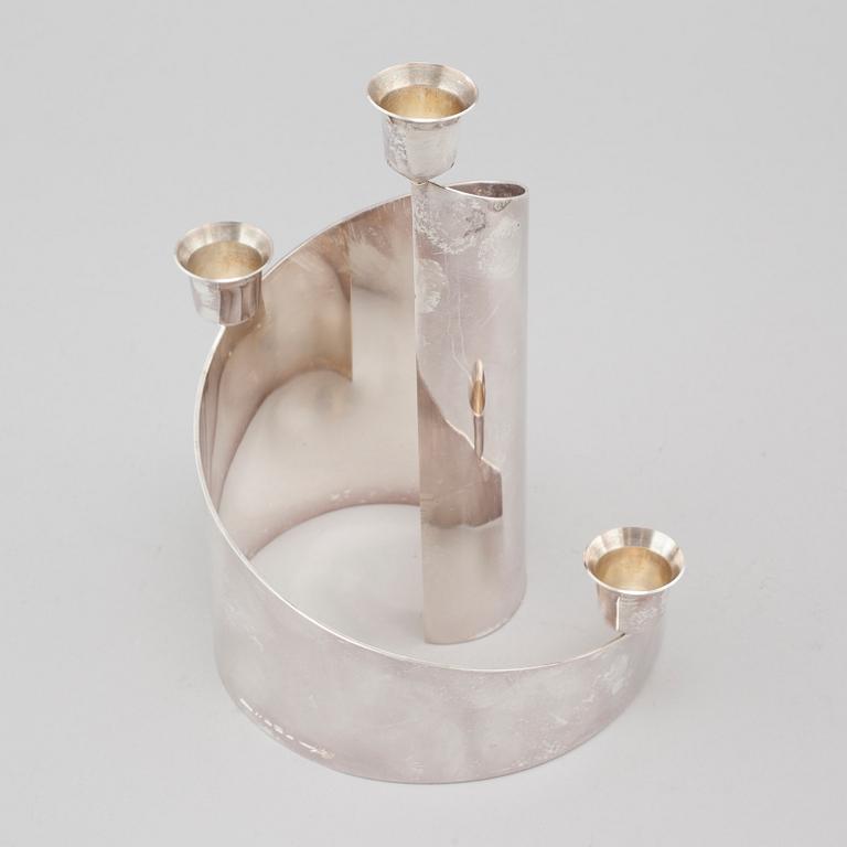 A candle holder in silver, unidentified designer, made by MEMA in linköping 1993. Weight 581 g.