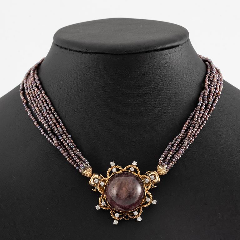 Multi-strand pearl necklace with two clasps set with carved coral, cabochon-cut tourmaline, and brilliant-cut diamonds.
