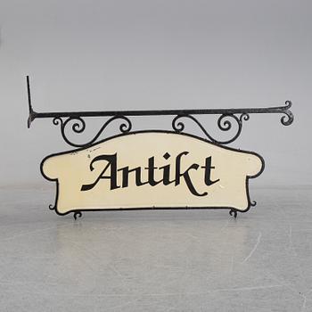 A wrought iron shop sign, 20th Century.
