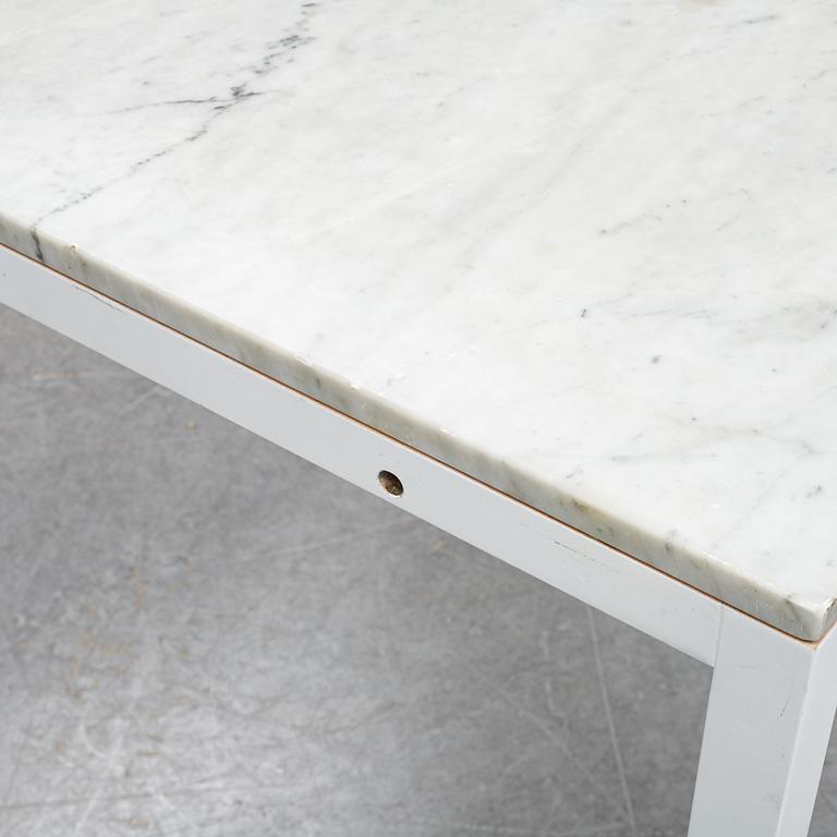 A marble top table, 21th century.