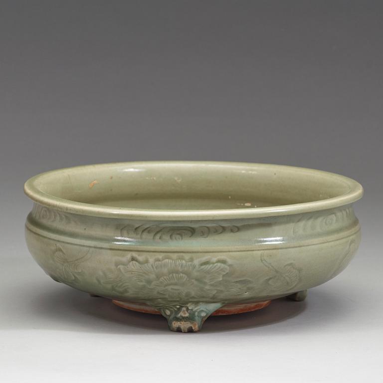 A large tripod celadon censer, presumably late Ming dynasty (1368-1644).