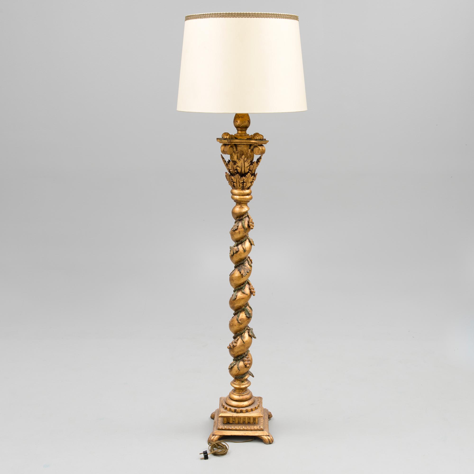A Baroque style 1920s standard lamp.