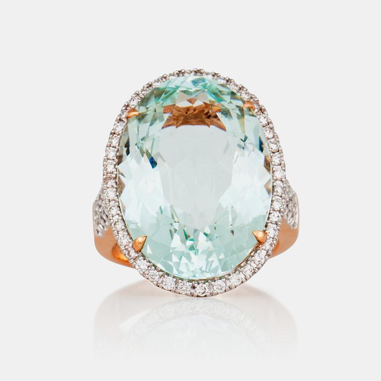 A 20.70 ct aquamarine and 0.83 ct diamond ring.