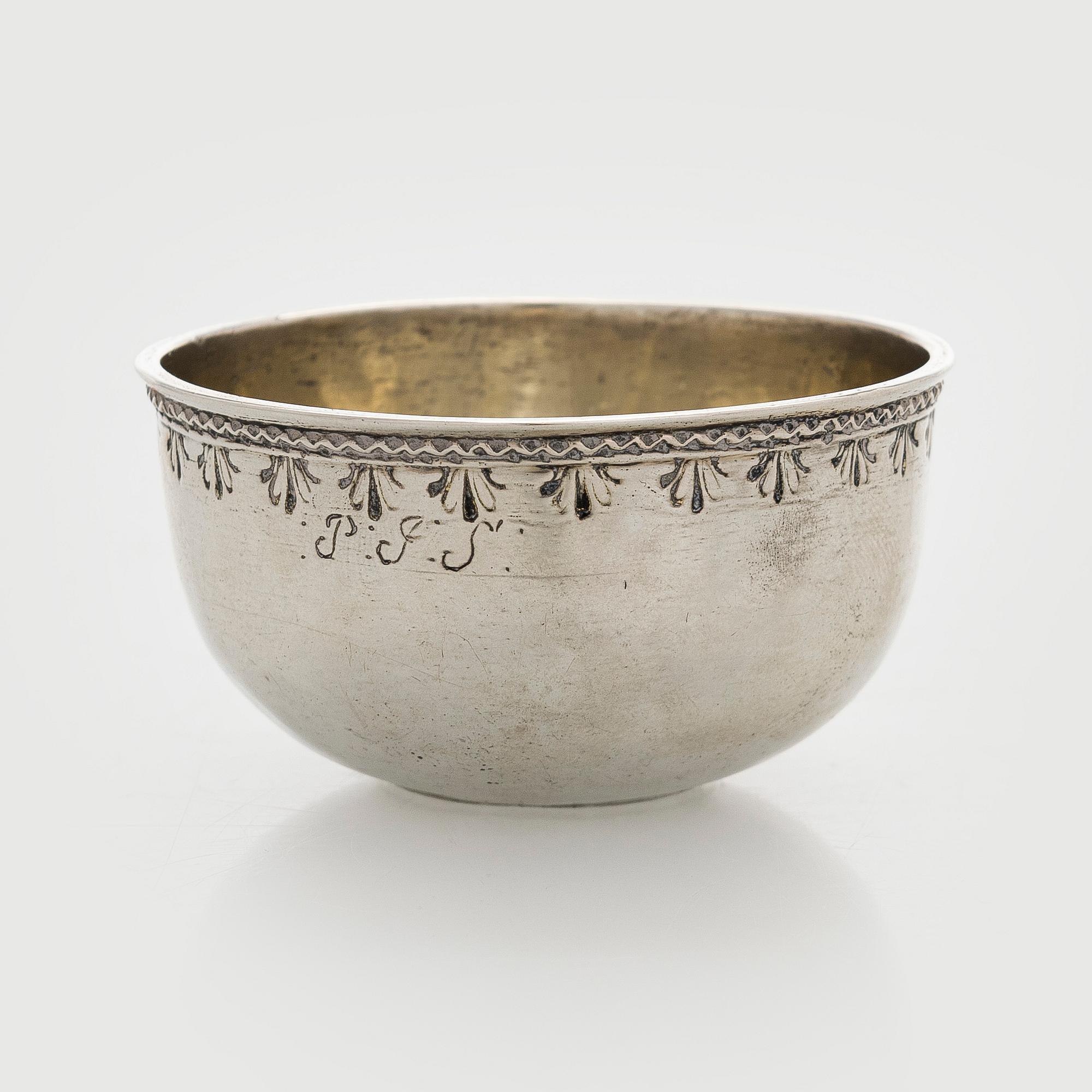 A silver tumbler with inset Swedish coin dated 1713.