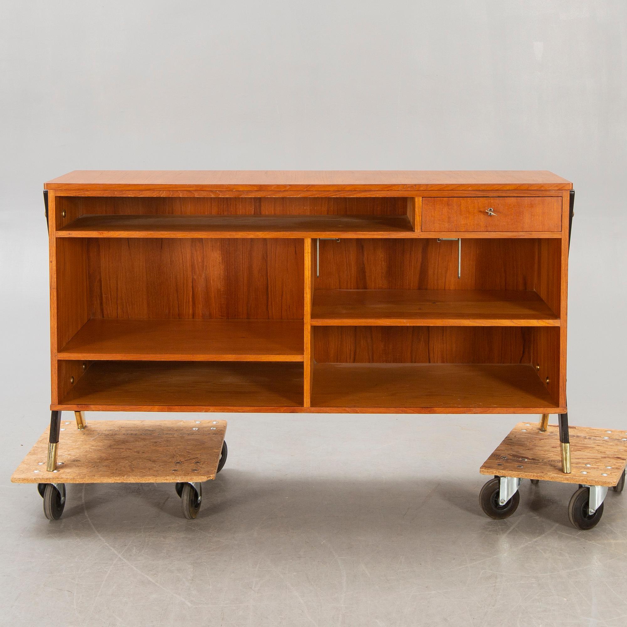 A mid 1900s teak counter.