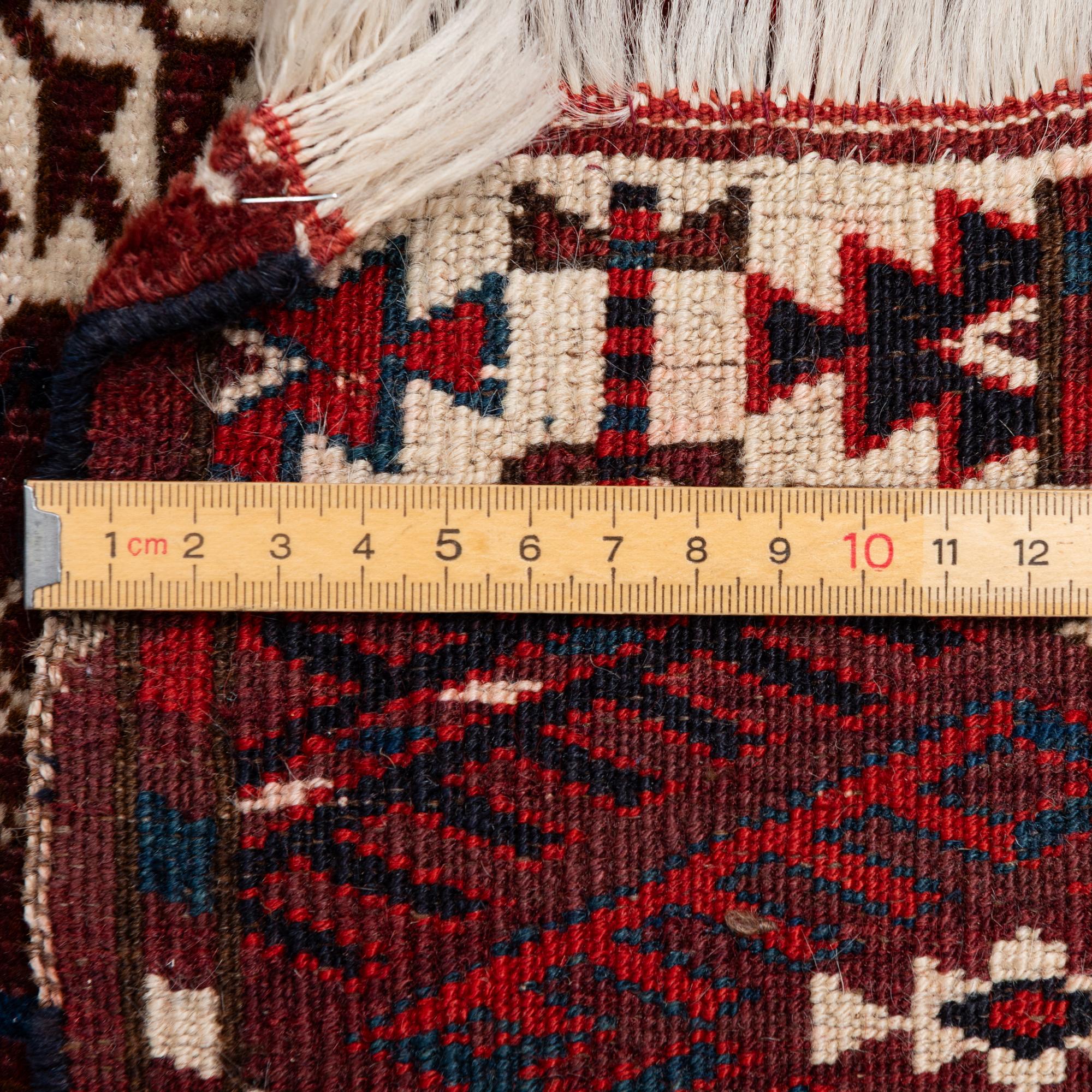 A Turkmen carpet, c. 293 x 210 cm.