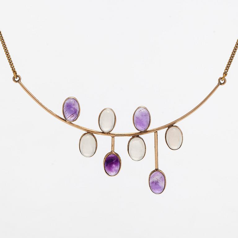 Kaulakoru, 14K kultaa, cabochonhiottu kuukvartsi ja ametisti. Suomalaiset leimat.