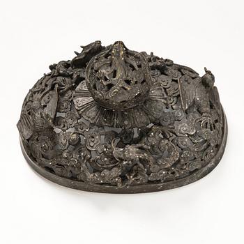 A bronze reticulated incense burner with cover, Qing dynasty (1644-1912).