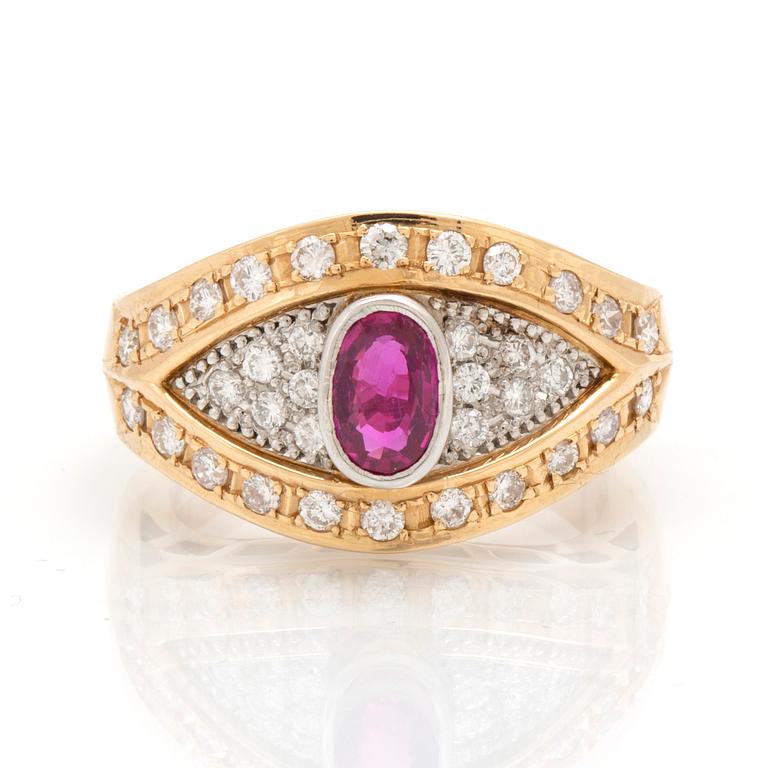 An 18K gold and platinum ring with diamonds and a ruby.