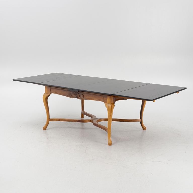 A Baroque style dining table , L.J. Larssons snickeriaffär, Mariefred, early 20th Century.