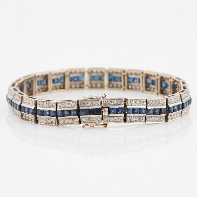 Bracelet 18K gold with round brilliant-cut diamonds and step-cut sapphires.