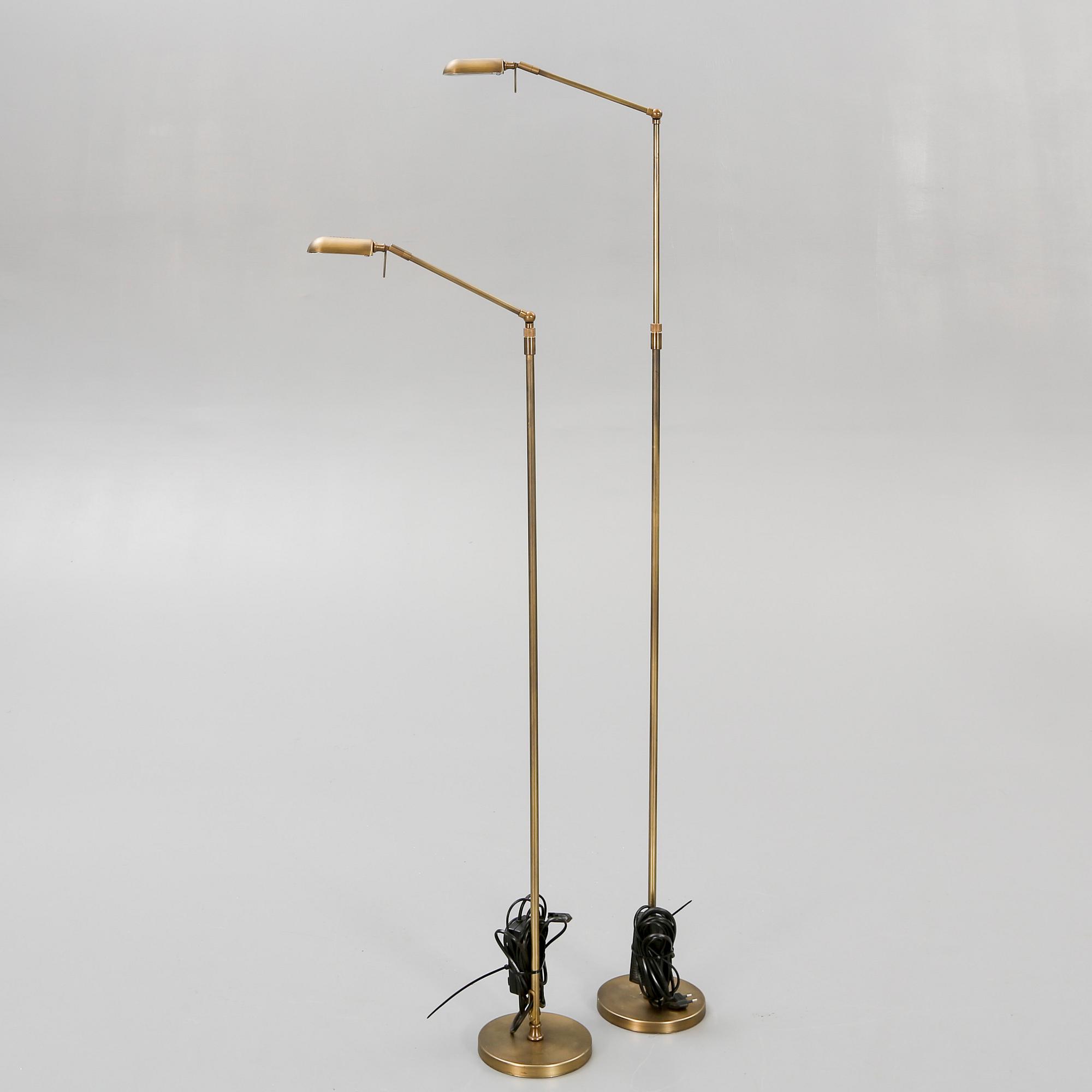 A pair of brass floor lamps 21 st century.