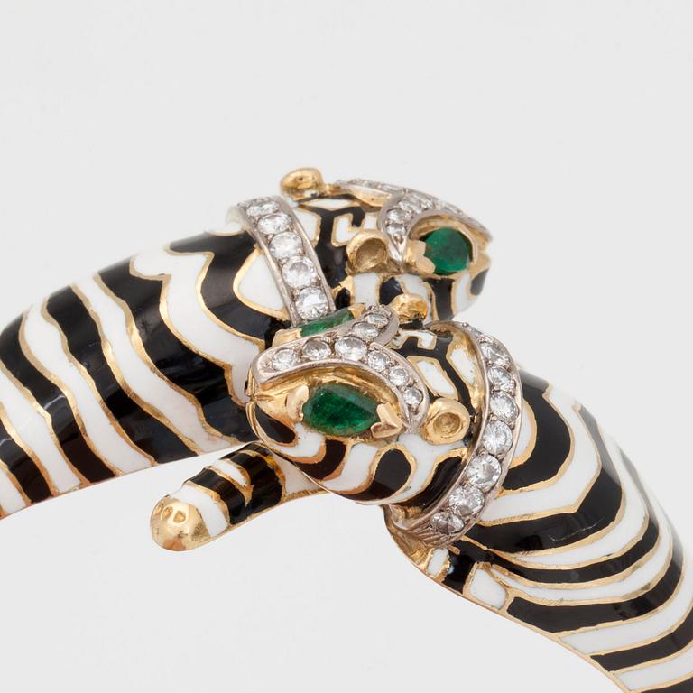 A diamond, enamel and emerald ring and bangle.