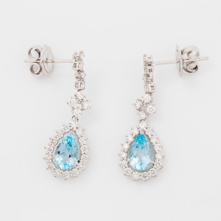 Topaz and brilliant-cut diamond earrings.