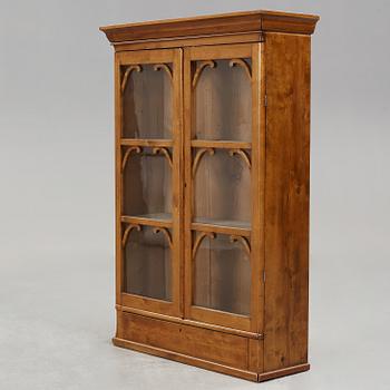 A mid 19th century hanging cabinet.