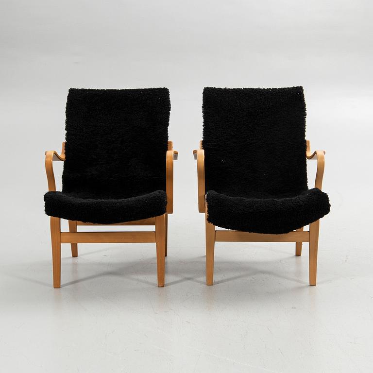 Bruno Mathsson, armchairs, a pair, "Eva", Bruno Mathsson International, Värnamo, second half of the 20th century.