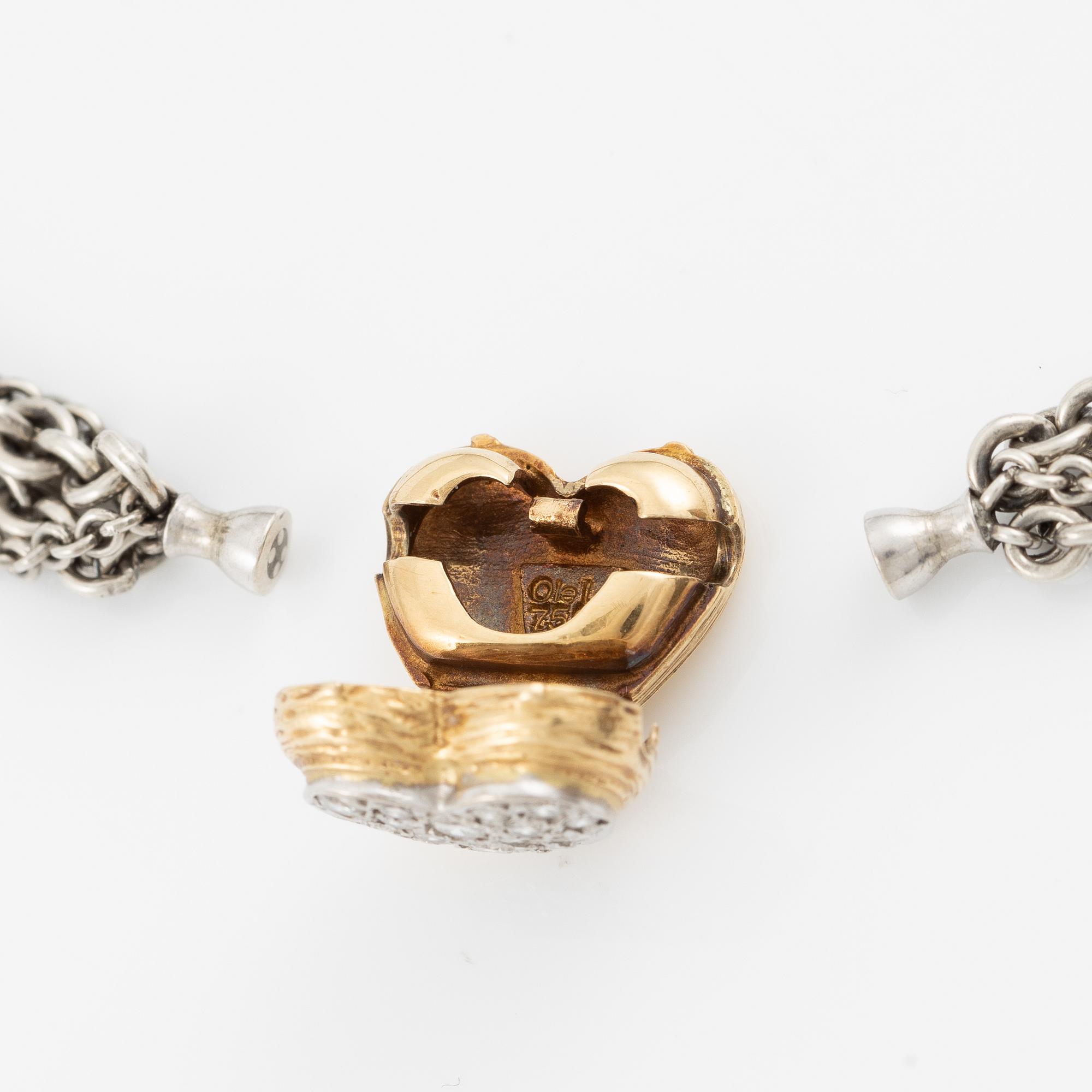 Necklace, Ole Lynggaard, with heart-shaped clasp in 18K gold set with brilliant-cut diamonds, chain in silver with four strands.