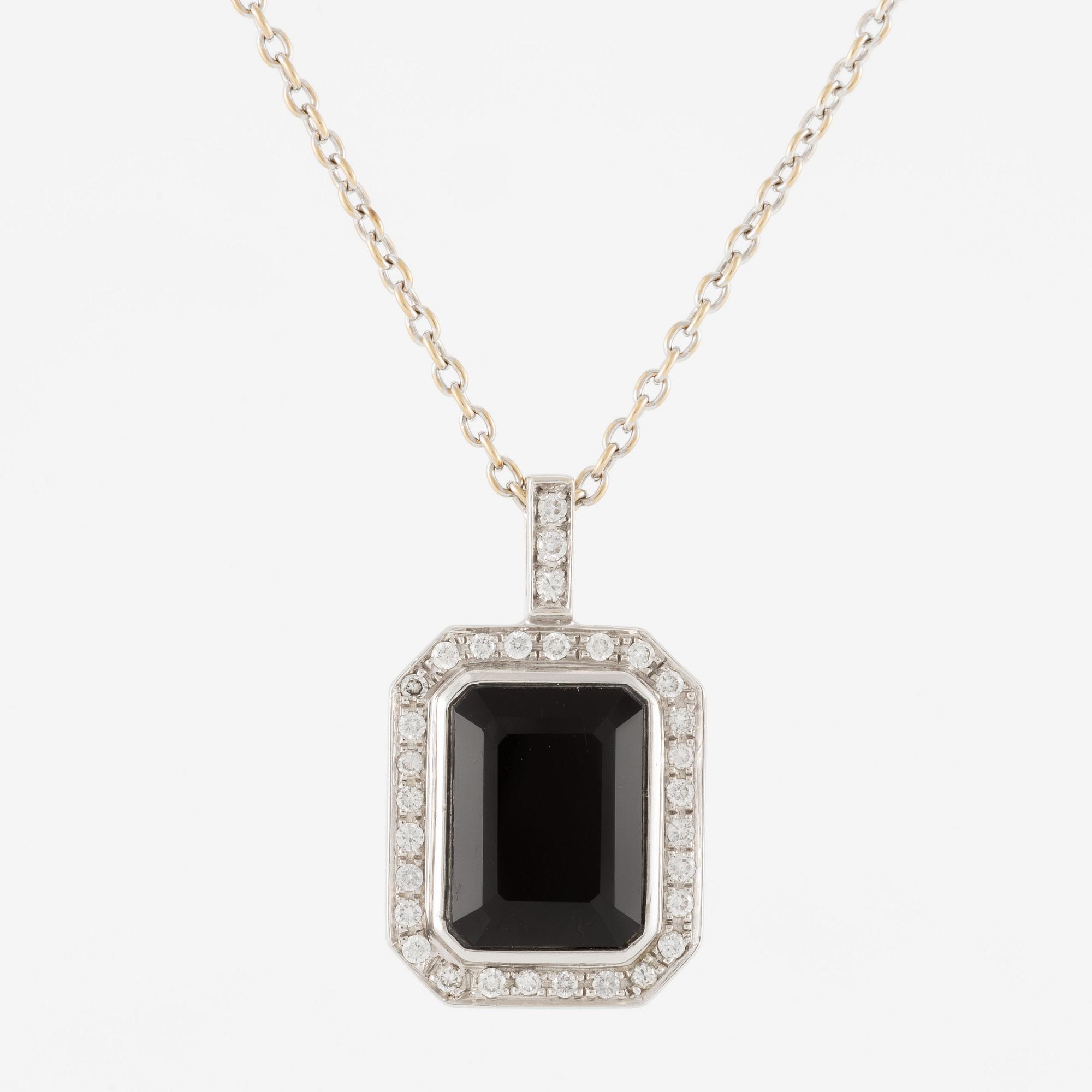 Pendant in 18K white gold set with brilliant-cut diamonds and likely onyx, with chain.