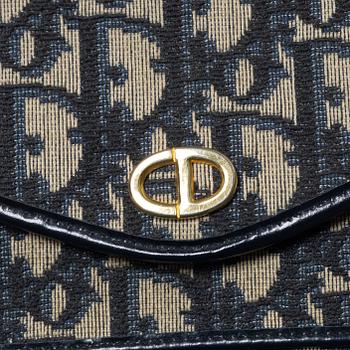 Christian Dior, a clutch and a scarf.