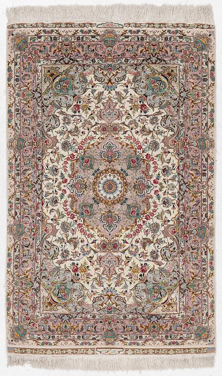 A Tabriz rug, signed, c. 160 x 101 cm.