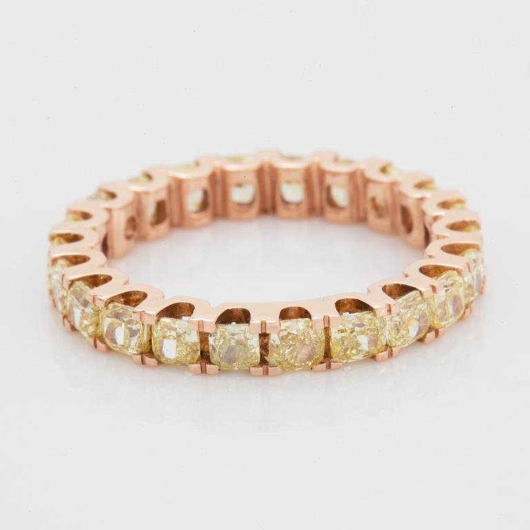 Cushion-cut yellow diamond eternity ring.